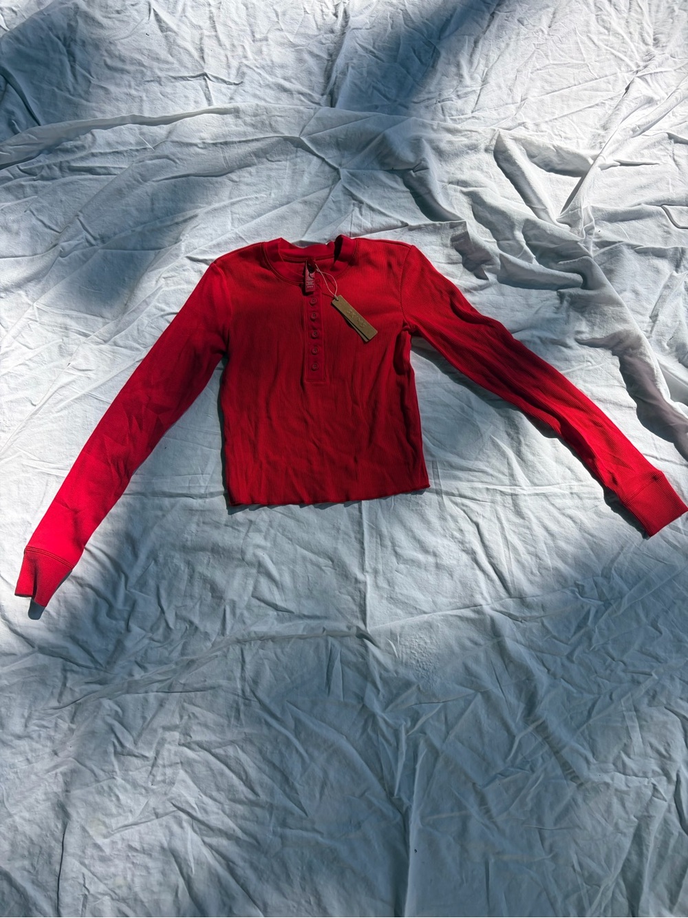 SKIMS Cotton Rib Henley Long Sleeve in cherry red
